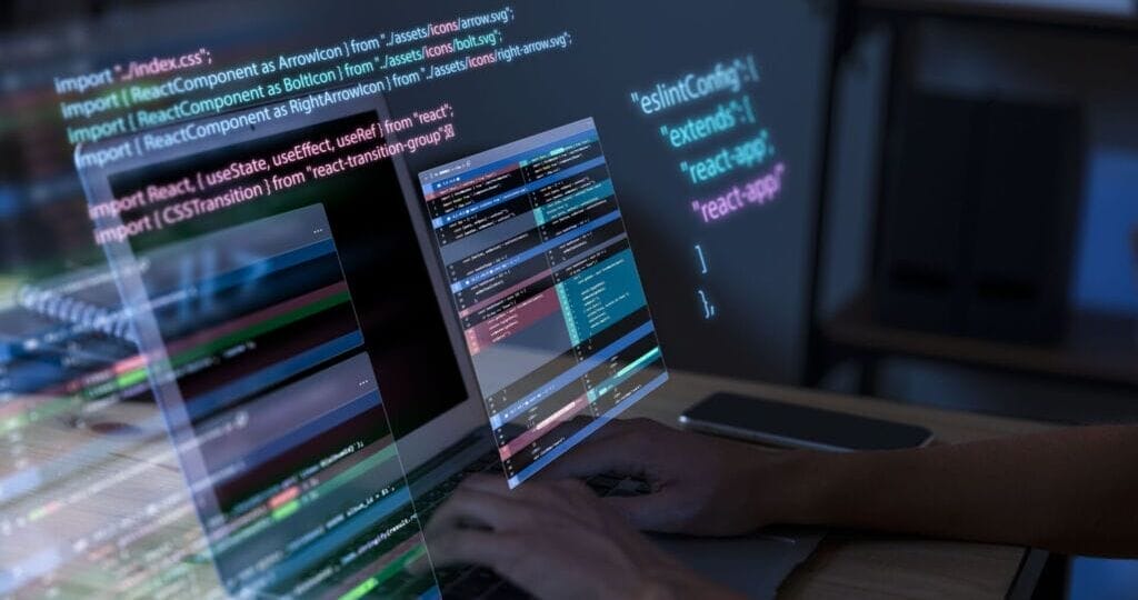 This image has an empty alt attribute; its file name is programming-background-with-person-working-with-codes-computer-1024x683.jpg