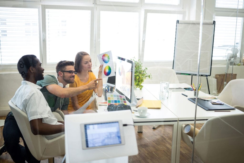 Group of graphic designers working on computer  Psycray