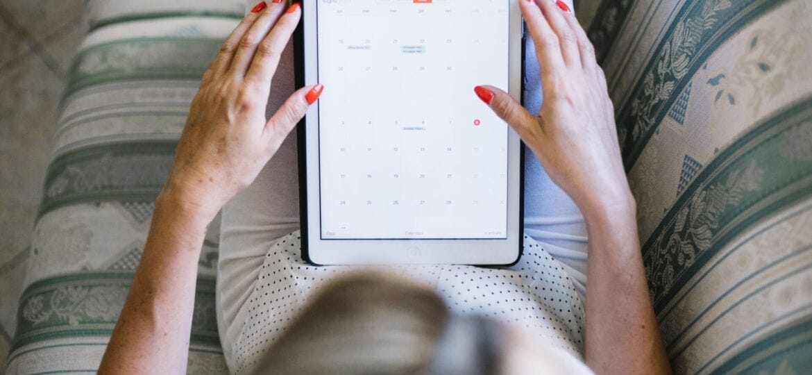 woman-watching-tablet-while-chilling-sofa