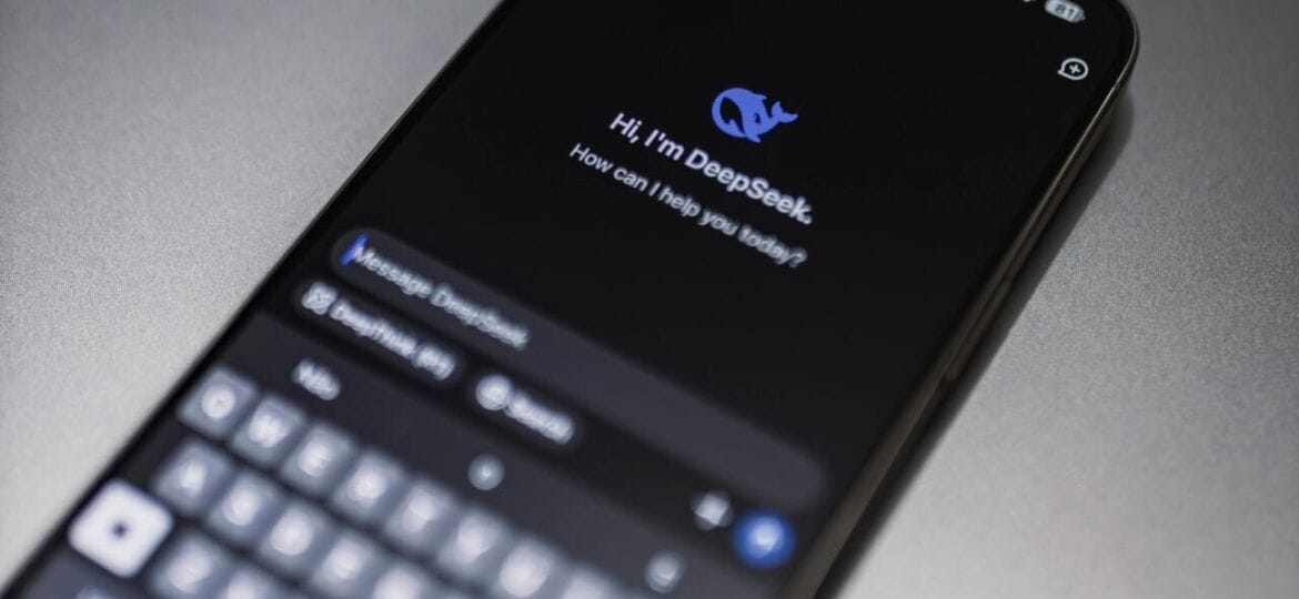 A phone displays an AI conversational app called "DeepSeek/"